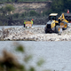 Workers assessing the San Jacinto River Superfund site in September 2017.